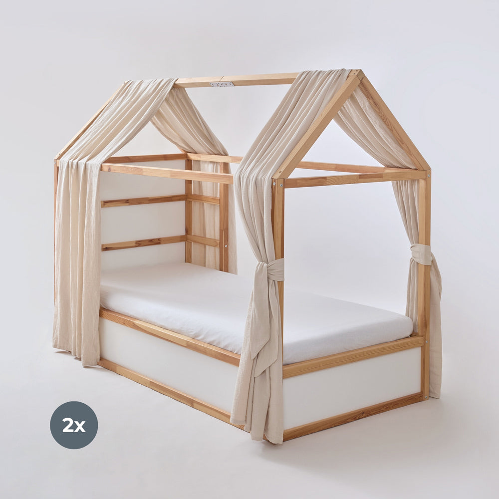 IKEA Kura Bett mit Dach und 2 Baldachinen aus Musselin in Beige.