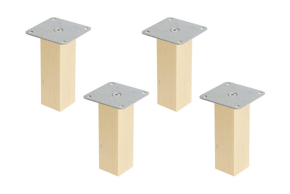 Vier Möbelfüße aus Holz.